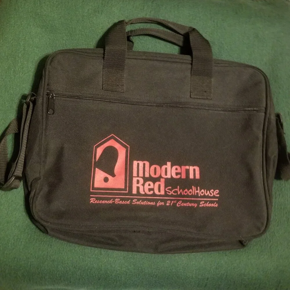 large black bag with straps, and ink-stained interior